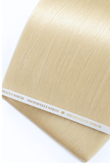 Close-up of glossy Golden Blonde human hair strands, Genius Weft – Rubin Extensions®